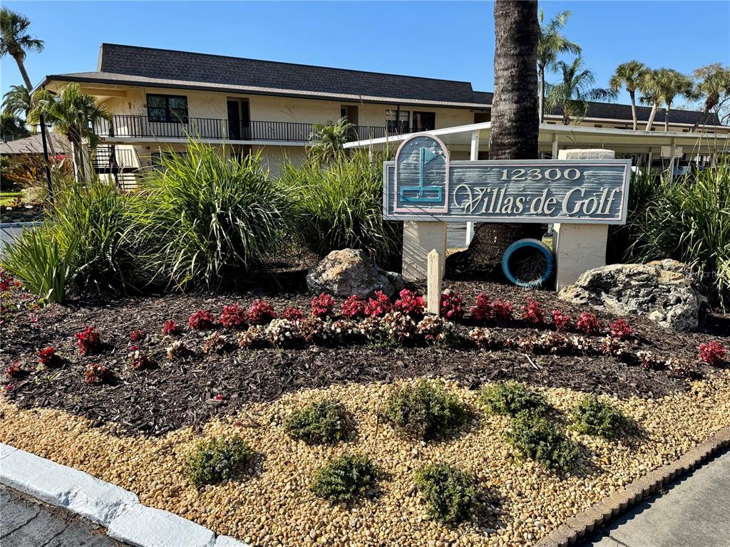 12300 Vonn Road, Unit 5304 Largo, FL 33774 - Photo 2 of 21 a front view of a house with a yard
