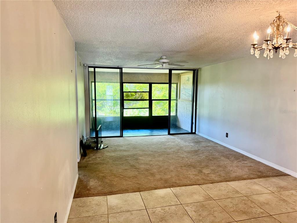 12300 Vonn Road, Unit 5304 Largo, FL 33774 - Photo 4 of 21 an empty room with windows and yard