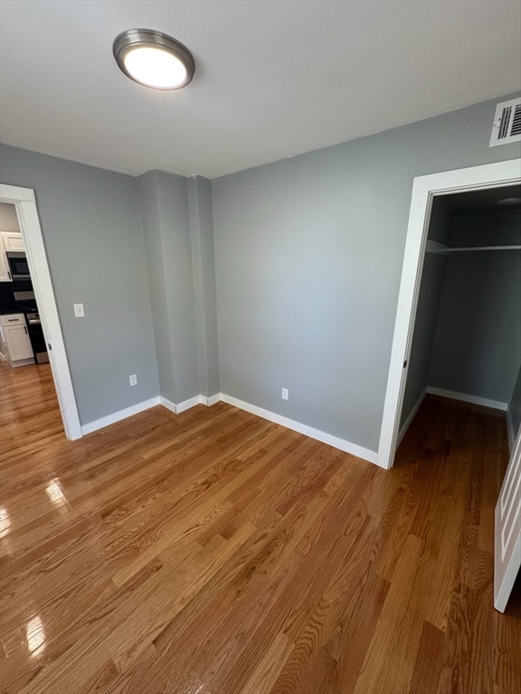 193 Winter Street, Unit 1 Saugus, MA 01906 - Photo 12 of 15 a view of empty room with wooden floor