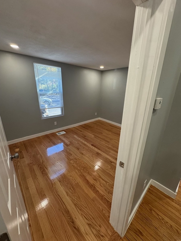 193 Winter Street, Unit 1 Saugus, MA 01906 - Photo 5 of 15 a view of empty room with wooden floor