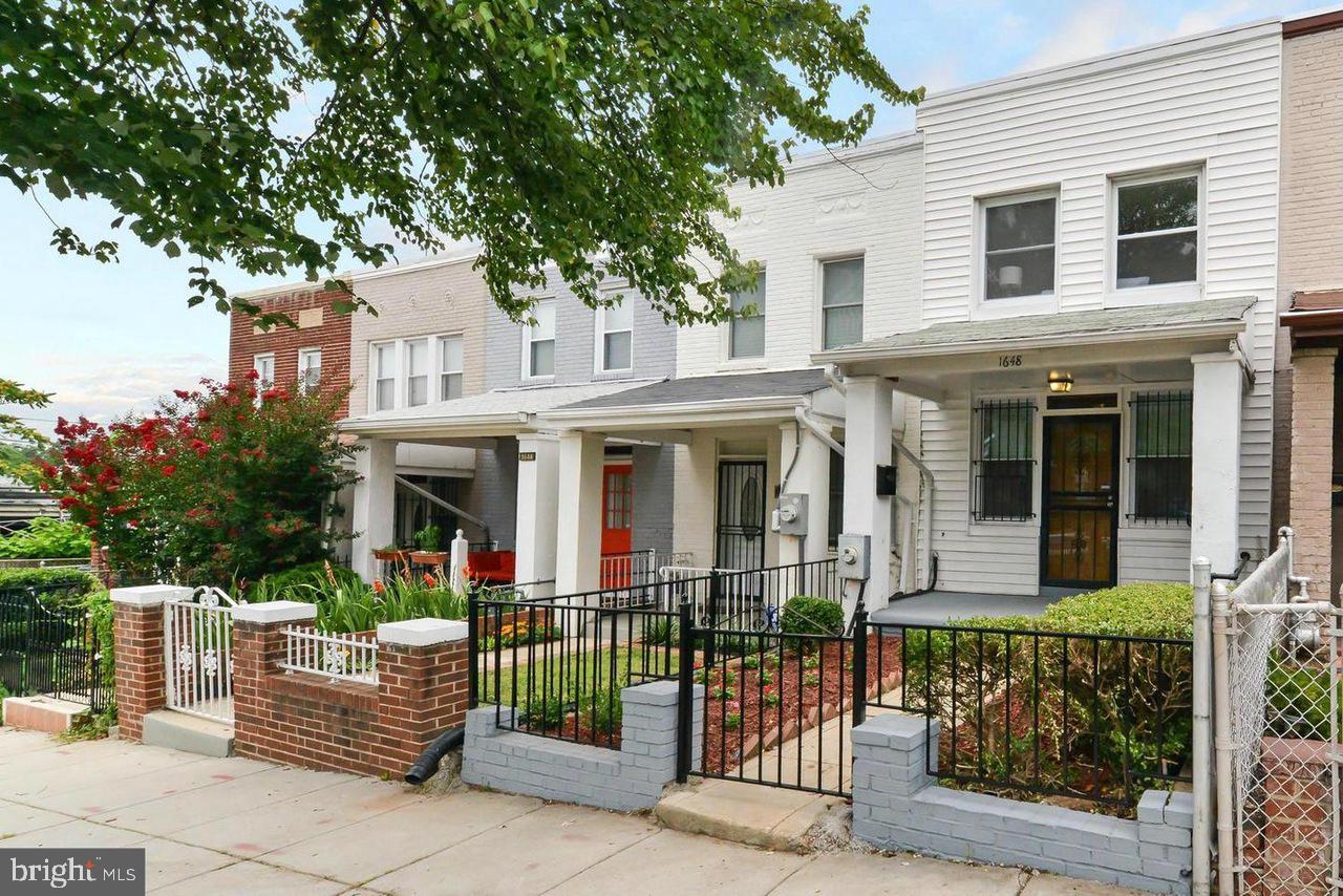 1648 L Street Northeast Washington, DC 20002 - Photo 1 of 27 a front view of a house with a garden