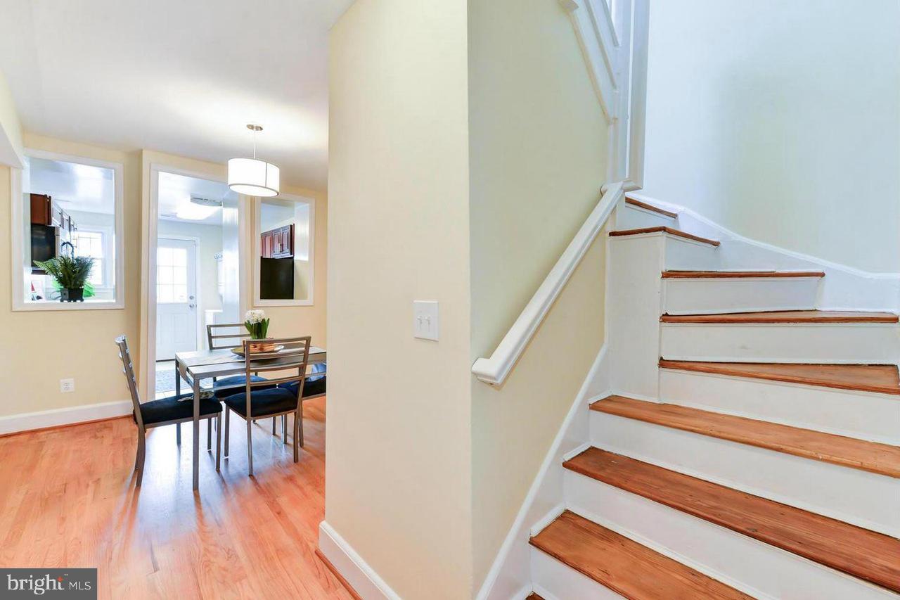 1648 L Street Northeast Washington, DC 20002 - Photo 14 of 27 a dining room with furniture and wooden floor