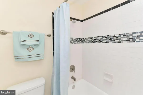 a bathroom with a bathtub and shower