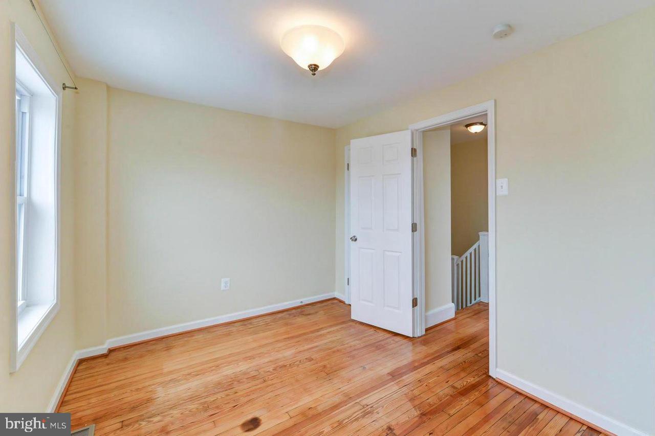 1648 L Street Northeast Washington, DC 20002 - Photo 21 of 27 a view of empty room with wooden floor