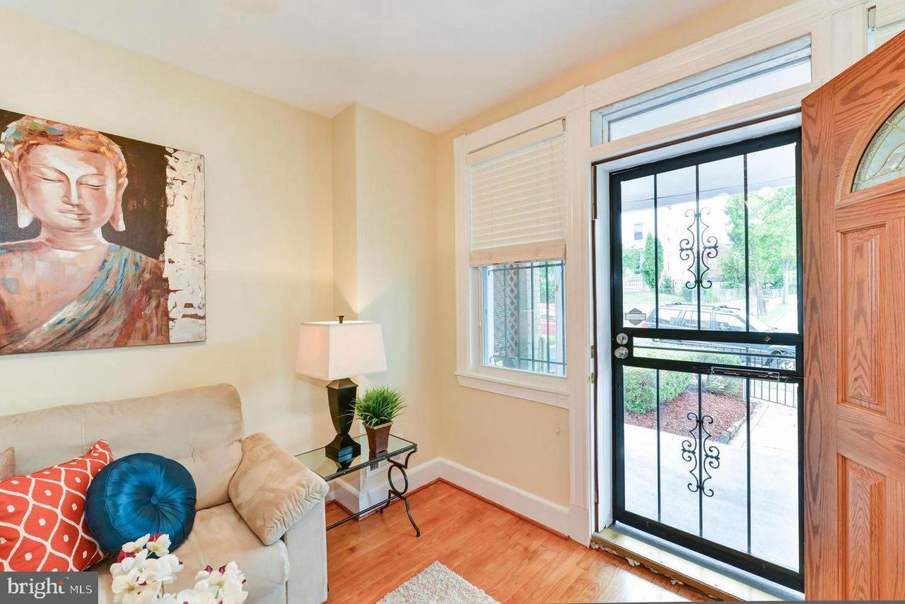 1648 L Street Northeast Washington, DC 20002 - Photo 4 of 27 a living room with furniture and a window