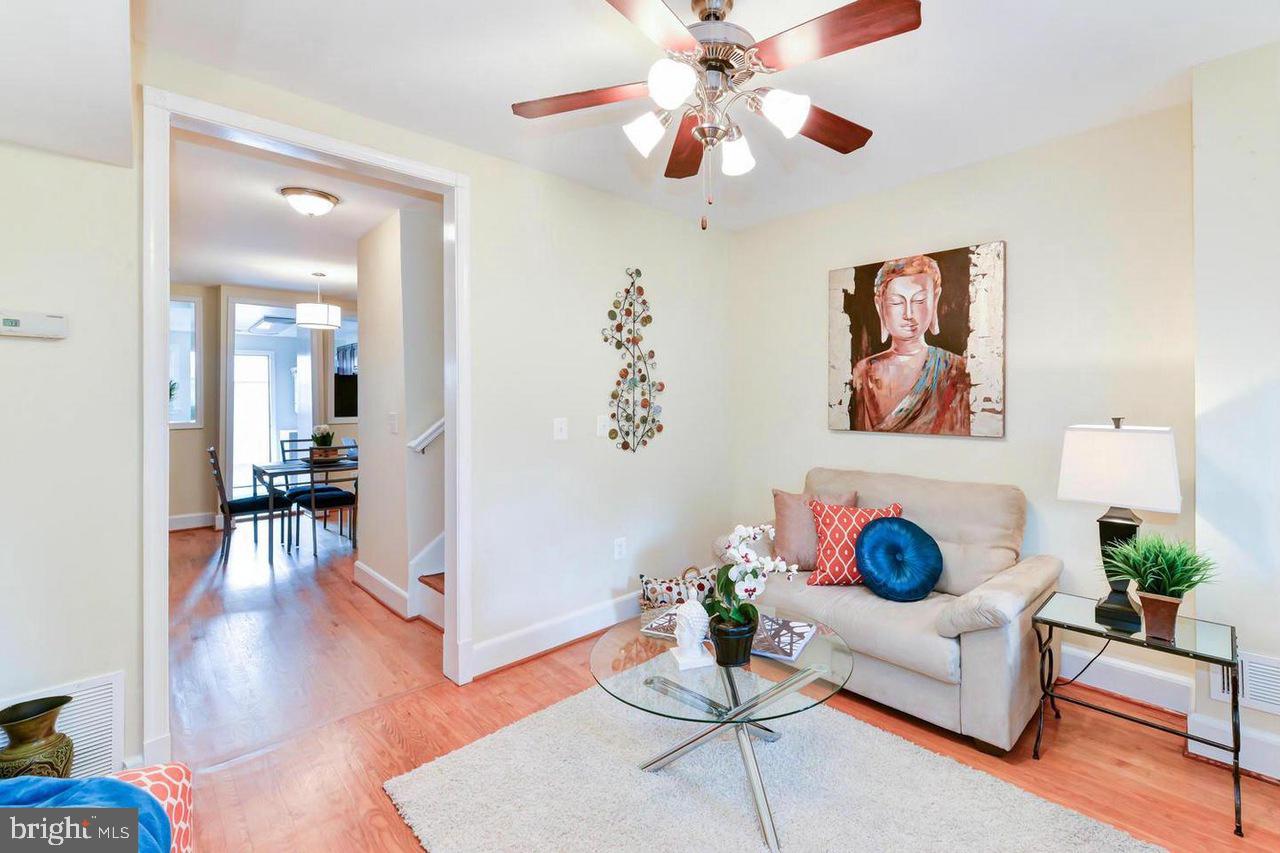 1648 L Street Northeast Washington, DC 20002 - Photo 5 of 27 a living room with furniture and a wooden floor