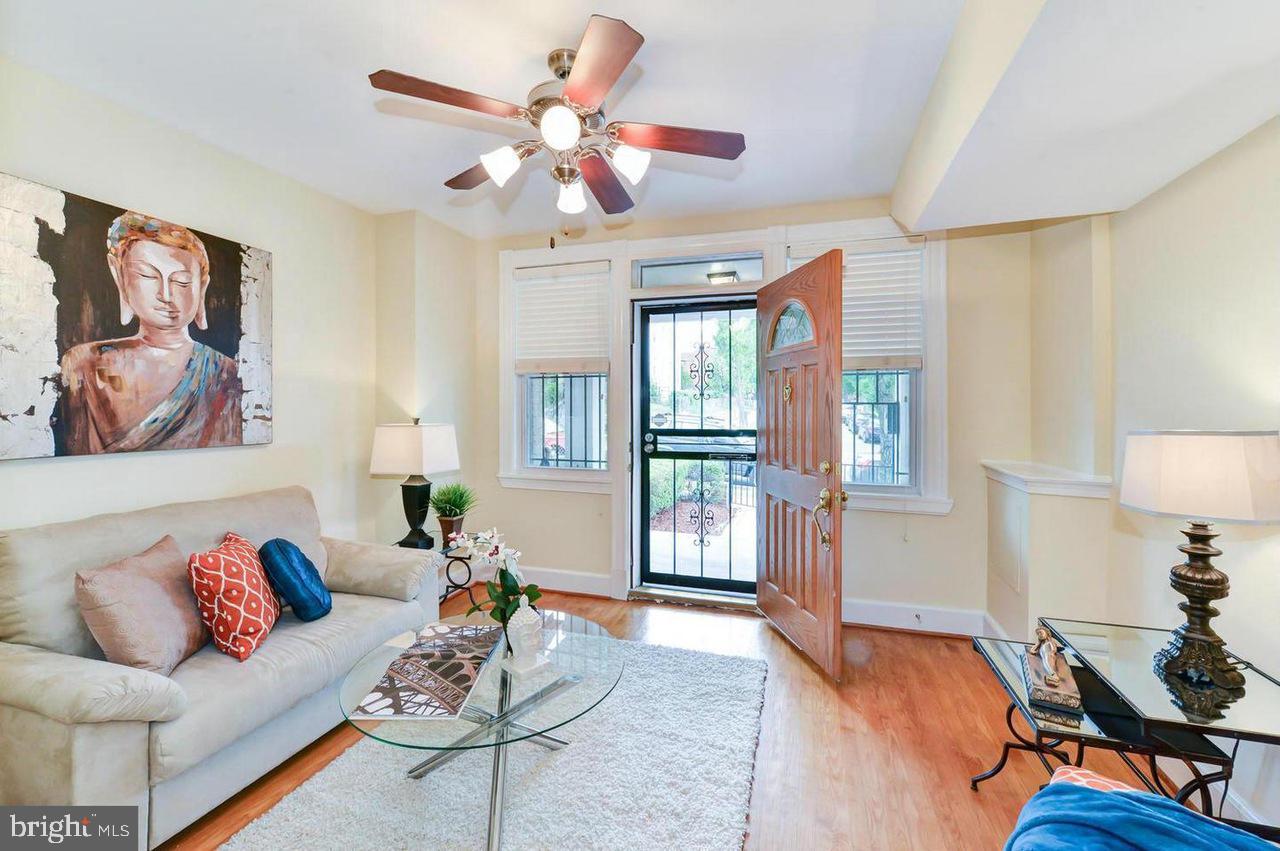 1648 L Street Northeast Washington, DC 20002 - Photo 6 of 27 a living room with furniture and wooden floor