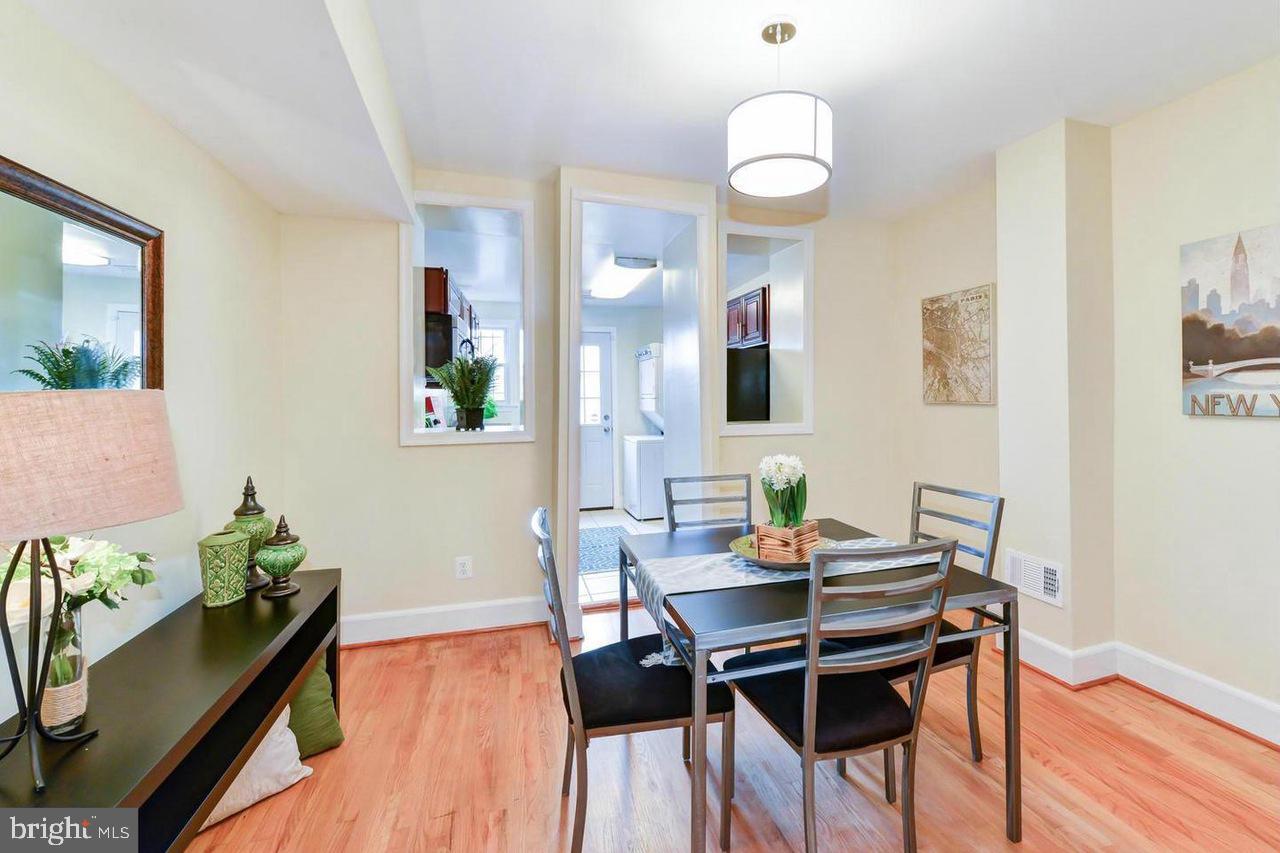 1648 L Street Northeast Washington, DC 20002 - Photo 7 of 27 a view of a dining room with furniture and wooden floor