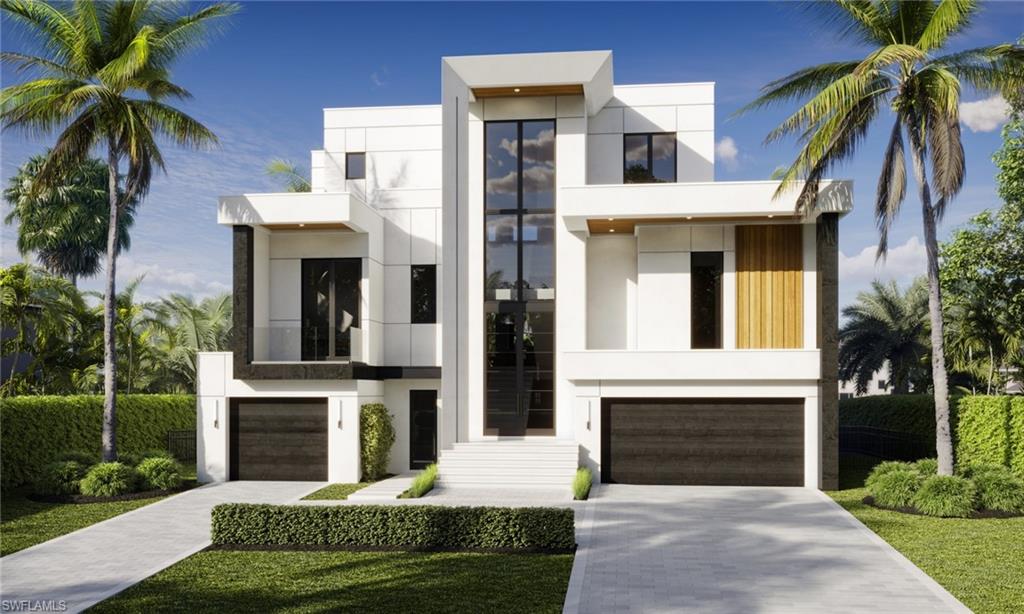 217 3rd Street Bonita Springs, FL 34134 - Photo 1 of 14 a front view of a house with a garden