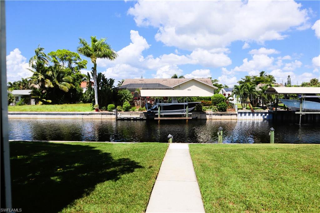217 3rd Street Bonita Springs, FL 34134 - Photo 14 of 14 a swimming pool with outdoor seating and lake view