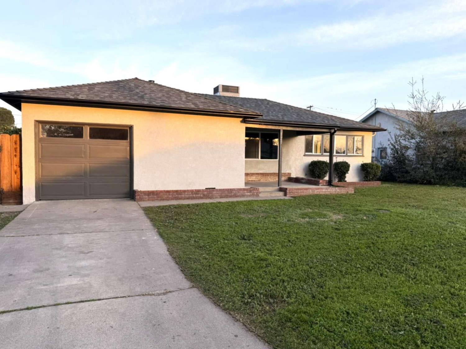 520 Colfax Avenue Modesto, CA 95354 - Photo 18 of 18 a front view of a house with garden