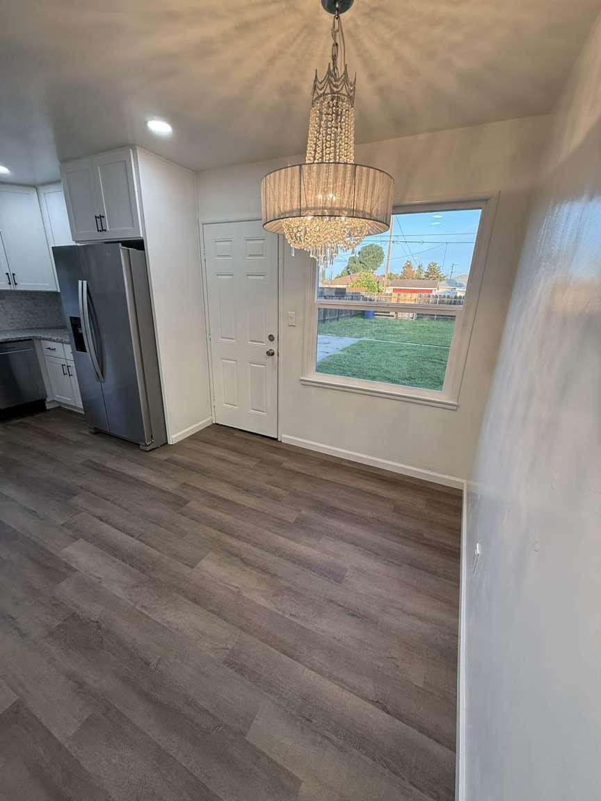 520 Colfax Avenue Modesto, CA 95354 - Photo 5 of 18 a view of a kitchen with a sink and refrigerator