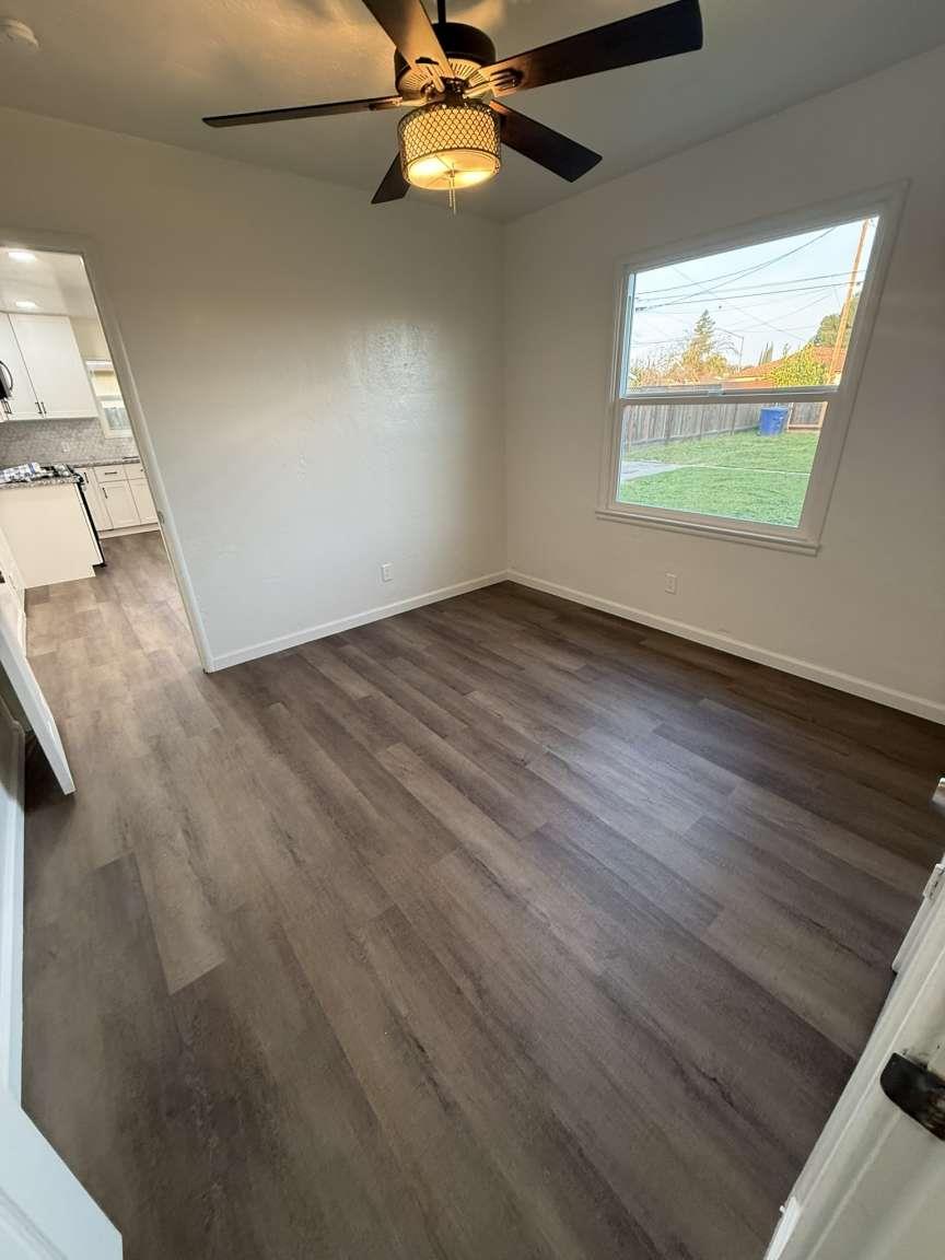 520 Colfax Avenue Modesto, CA 95354 - Photo 10 of 18 wooden floor in an empty room with a window