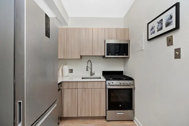 a kitchen with a stove and a microwave
