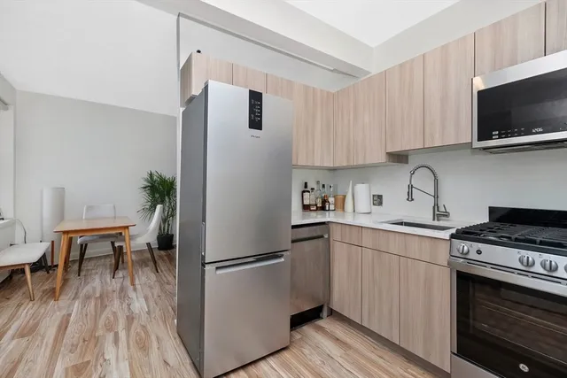 a kitchen with a stove and a microwave