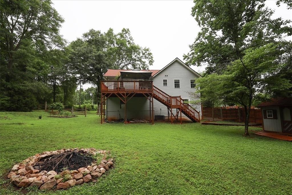 236 Hiram Sudie Road Dallas, GA 30157 - Photo 24 of 26 a view of a house with a yard and sitting area