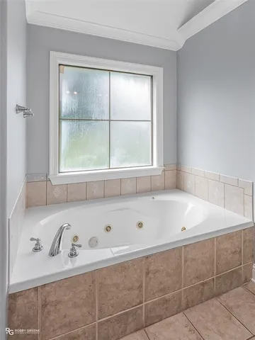 a bath tub sitting next to a window