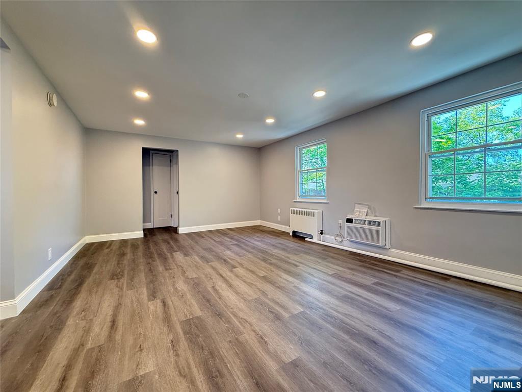 20 Clark Court Rutherford, NJ 07070 - Photo 4 of 29 a view of empty room with wooden floor and fan
