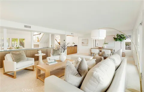 a kitchen with stainless steel appliances a stove a sink and cabinets