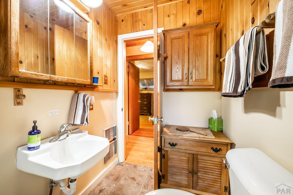 9600 Middle Creek Canyon Road Beulah, CO 81023 - Photo 26 of 50 a bathroom with a sink and a mirror