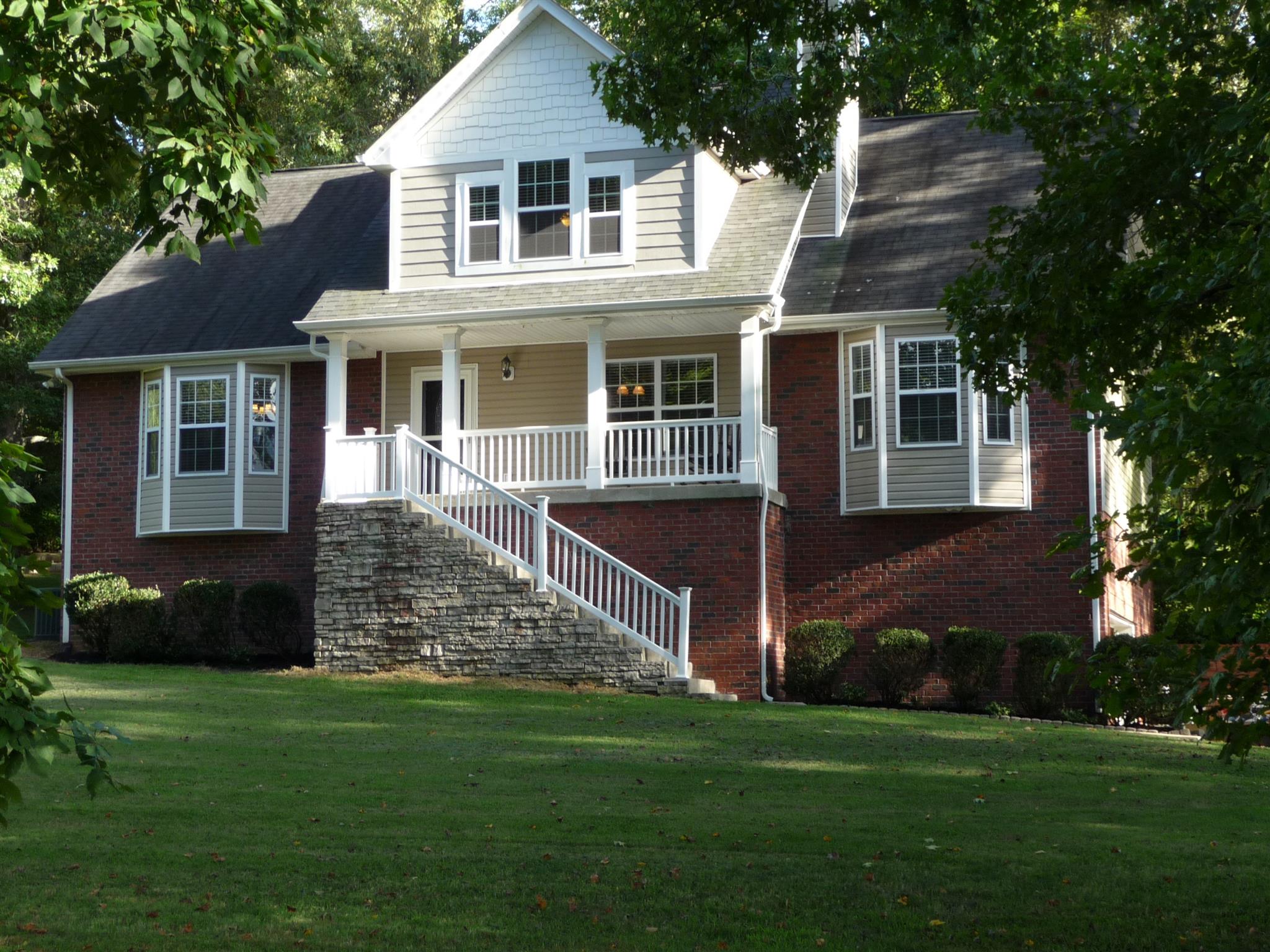 198 Wilkinson Road Cottontown, TN 37048 - Photo 1 of 23 a front view of a house with a yard