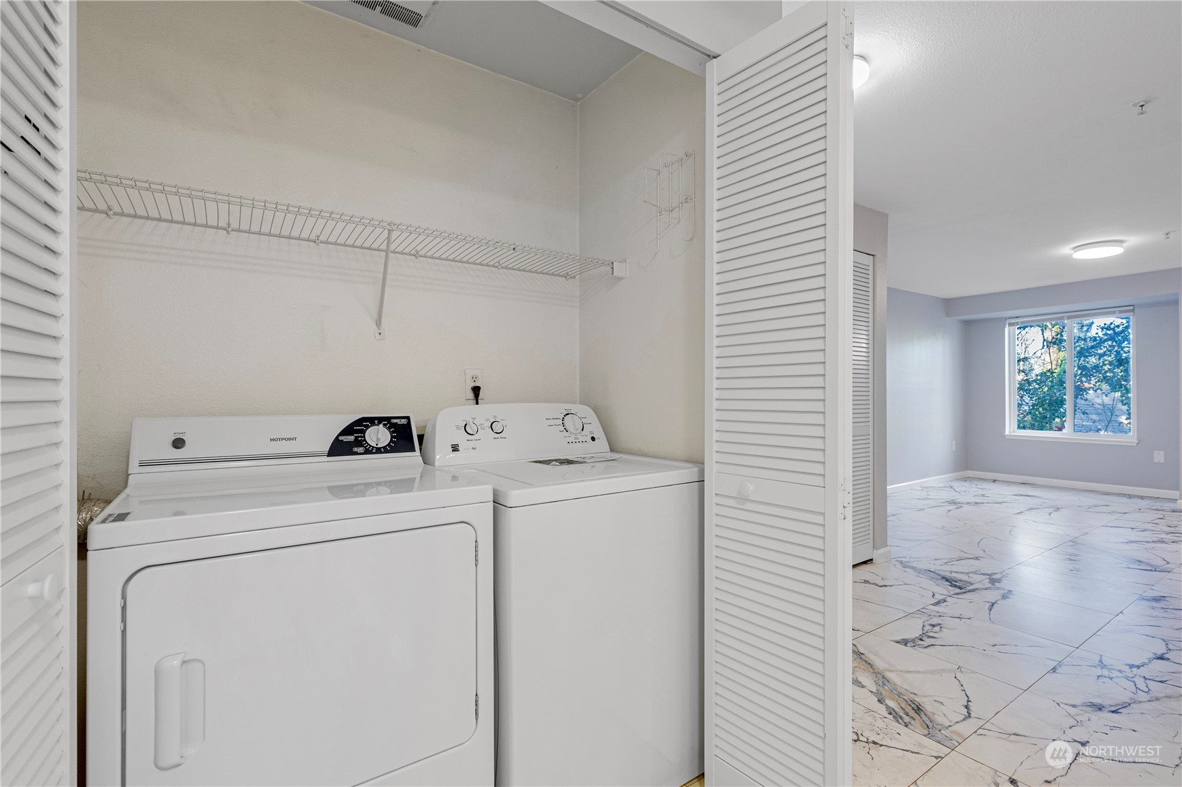 11002 Southeast Petrovitsky Road, Unit F202 Renton, WA 98055 - Photo 11 of 20 a utility room with dryer and washer