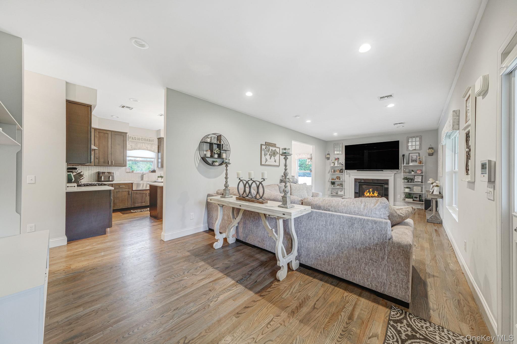 86 Country Road Medford, NY 11763 - Photo 15 of 47 Spacious LR with HW Floors, Gas Fireplace, Recessed Lighting, Open Flow to EIK and Formal DR