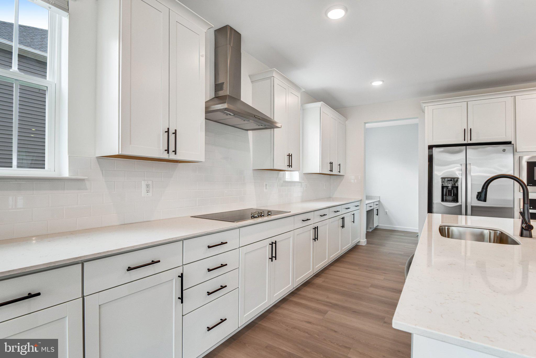 2071 Springvale Drive Bealeton, VA 22712 - Photo 16 of 64 a large kitchen with stainless steel appliances granite countertop a sink a stove and a refrigerator