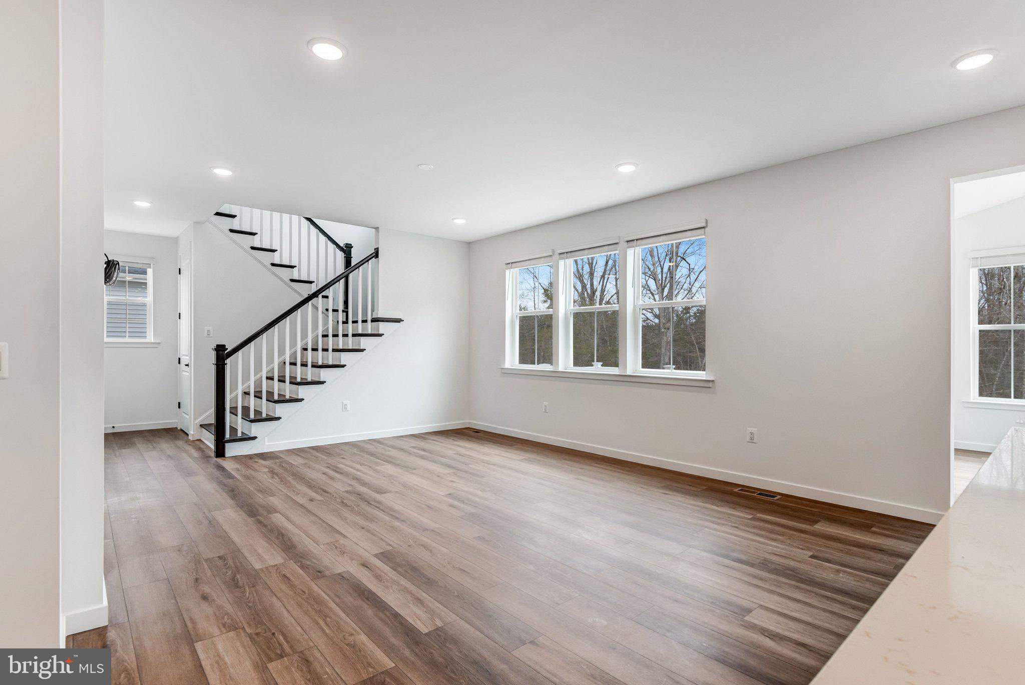 2071 Springvale Drive Bealeton, VA 22712 - Photo 19 of 64 a view of an empty room with wooden floor and a window