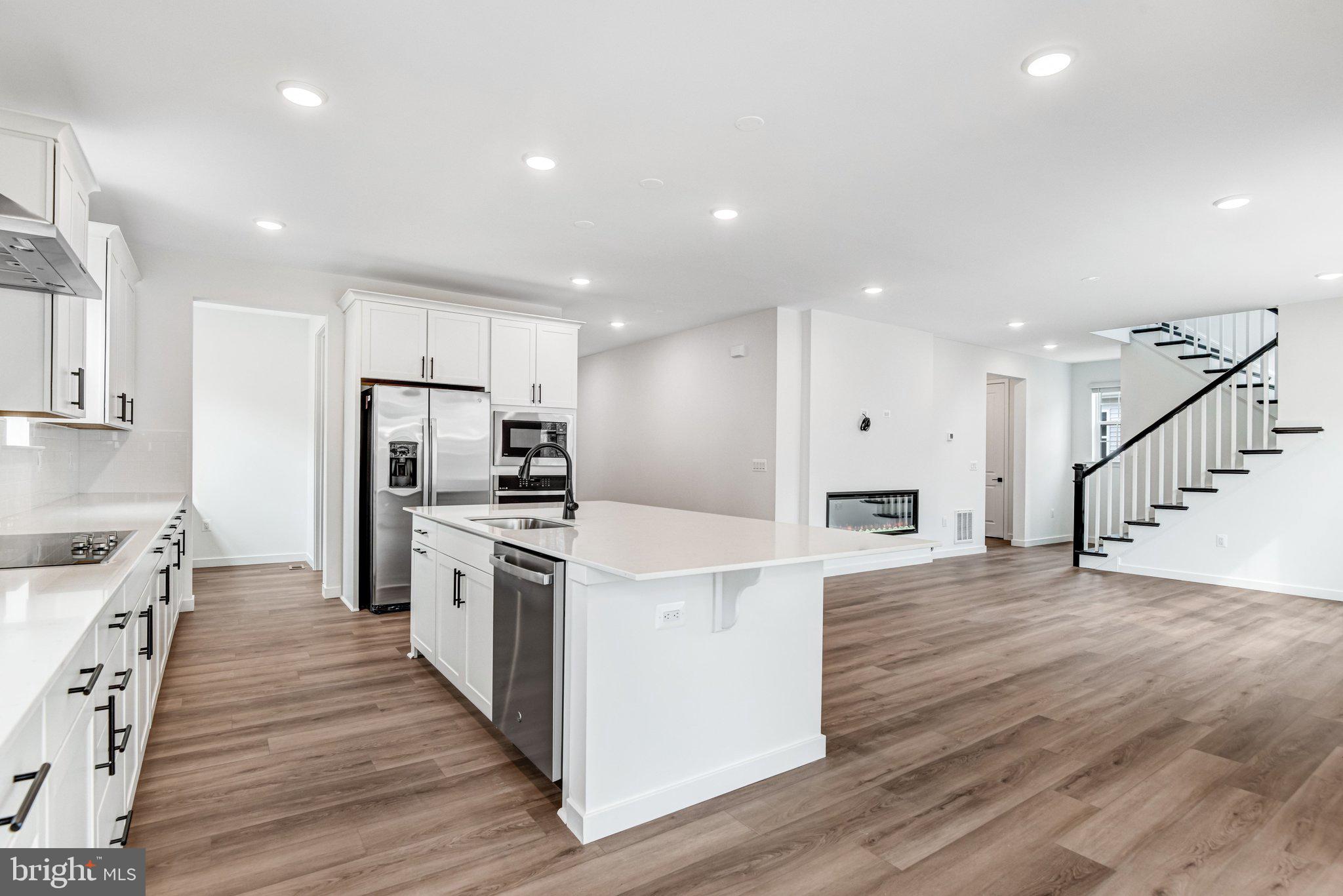 2071 Springvale Drive Bealeton, VA 22712 - Photo 23 of 64 a kitchen with stainless steel appliances a refrigerator and a stove top oven