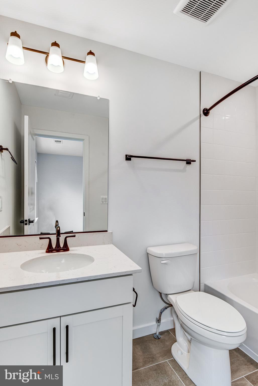 2071 Springvale Drive Bealeton, VA 22712 - Photo 34 of 64 a bathroom with a sink toilet and mirror