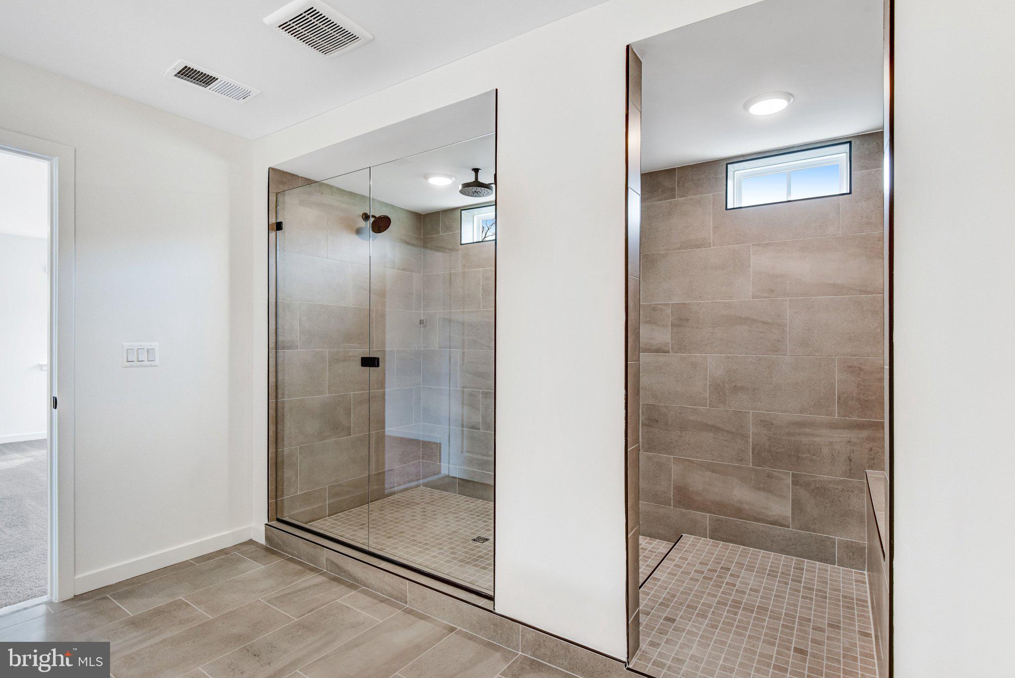 2071 Springvale Drive Bealeton, VA 22712 - Photo 40 of 64 a bathroom with a shower and a glass door