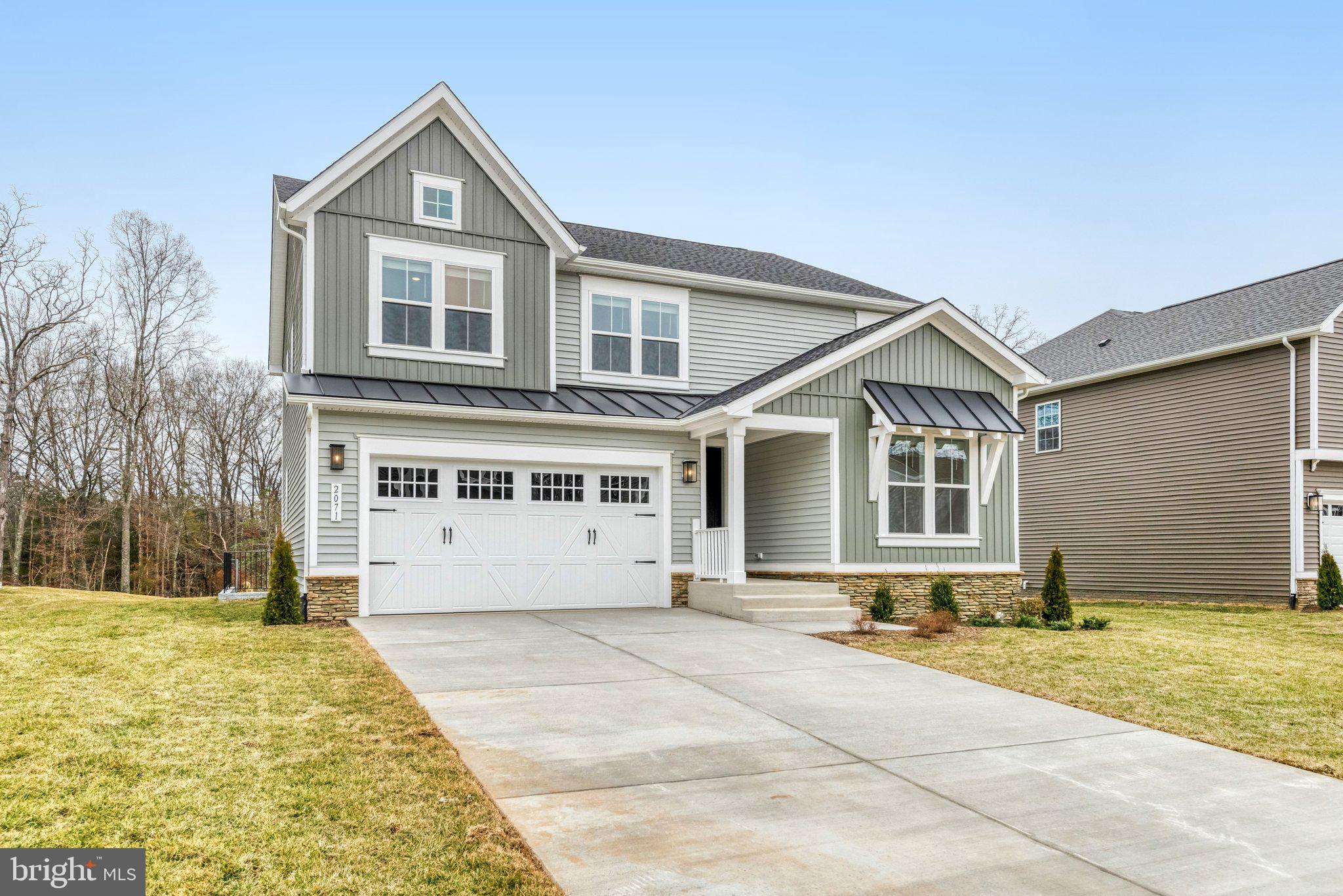 2071 Springvale Drive Bealeton, VA 22712 - Photo 4 of 64 a front view of a house with a yard