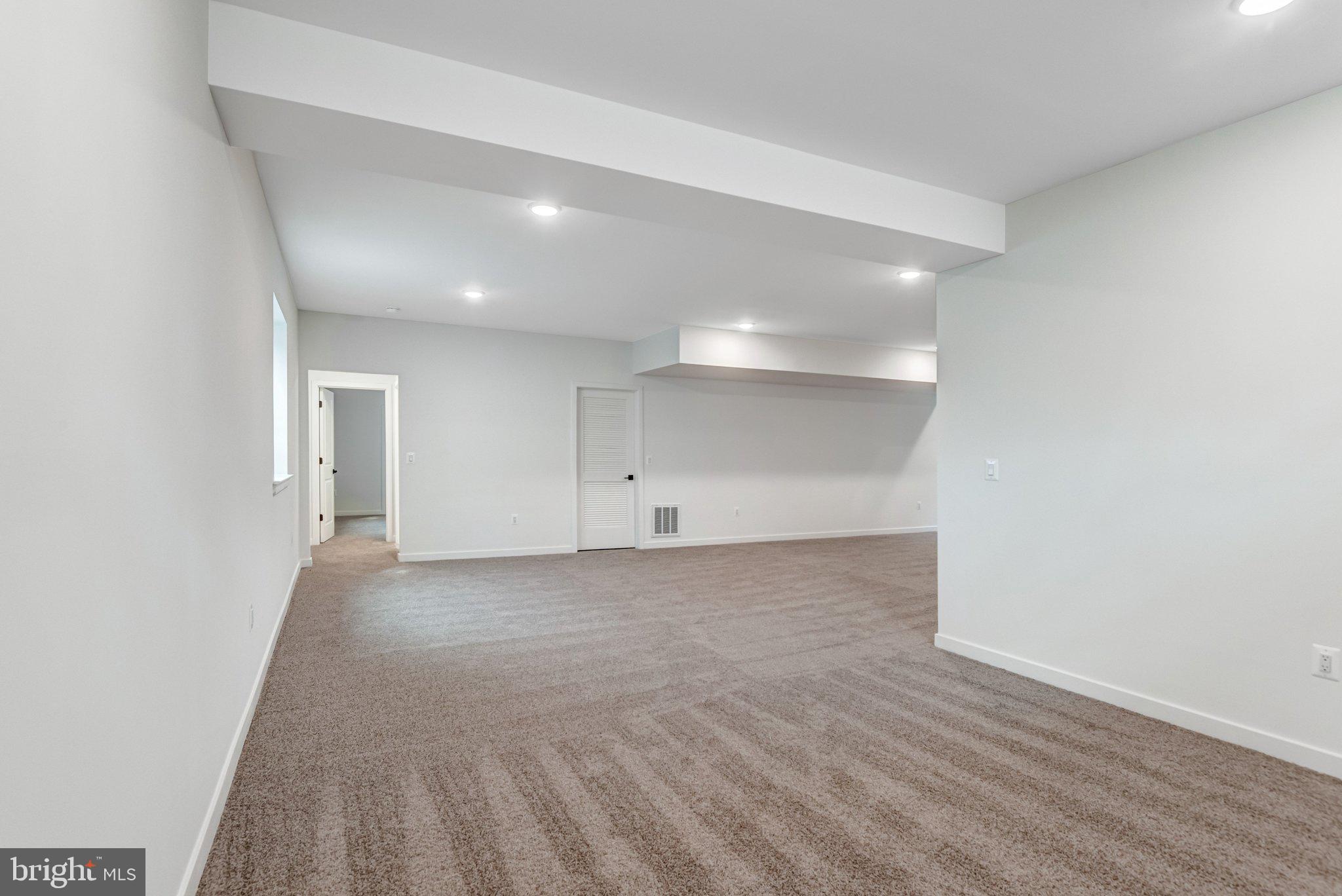 2071 Springvale Drive Bealeton, VA 22712 - Photo 44 of 64 a view of a big room with wooden floor and windows