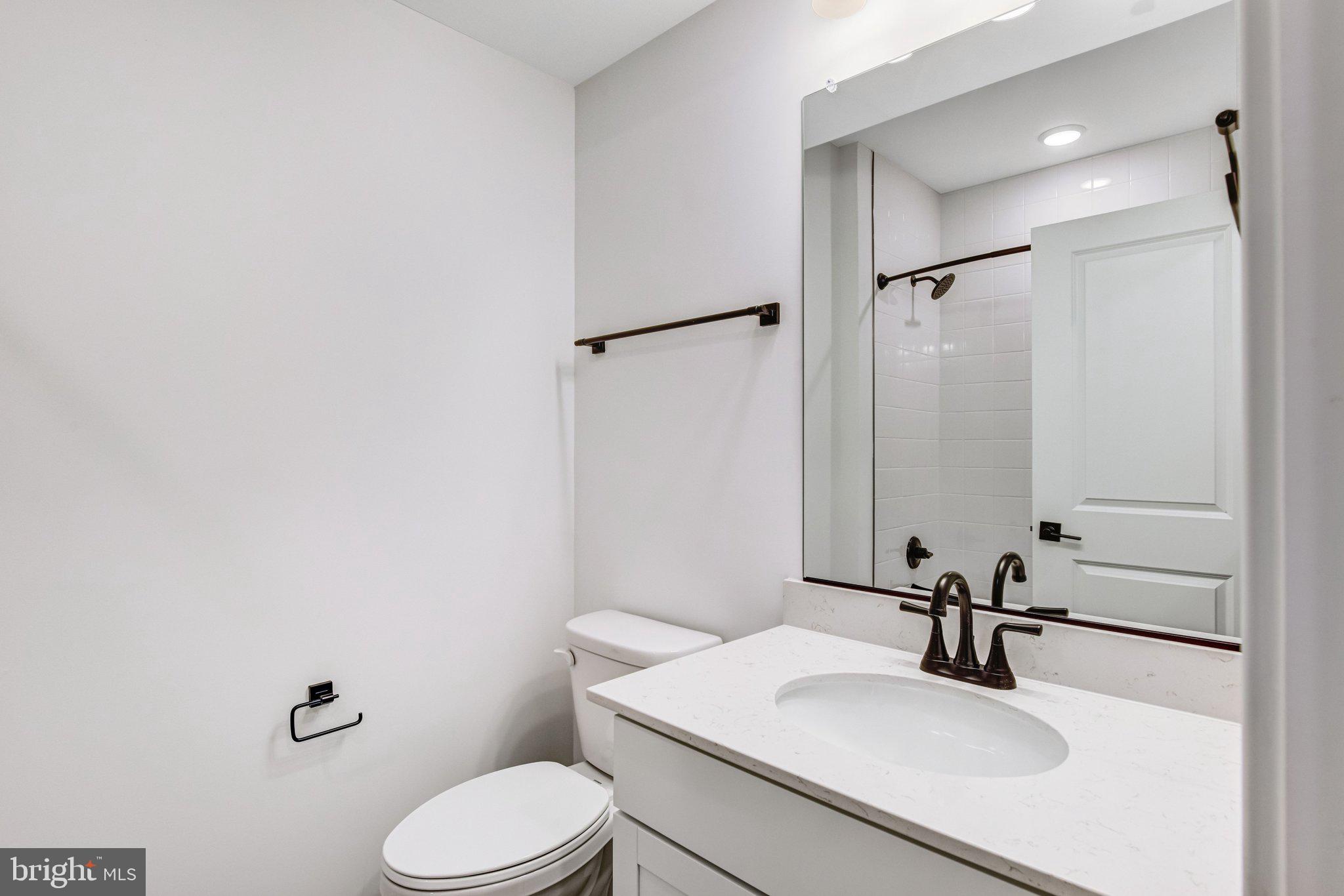2071 Springvale Drive Bealeton, VA 22712 - Photo 47 of 64 a bathroom with a sink toilet and mirror