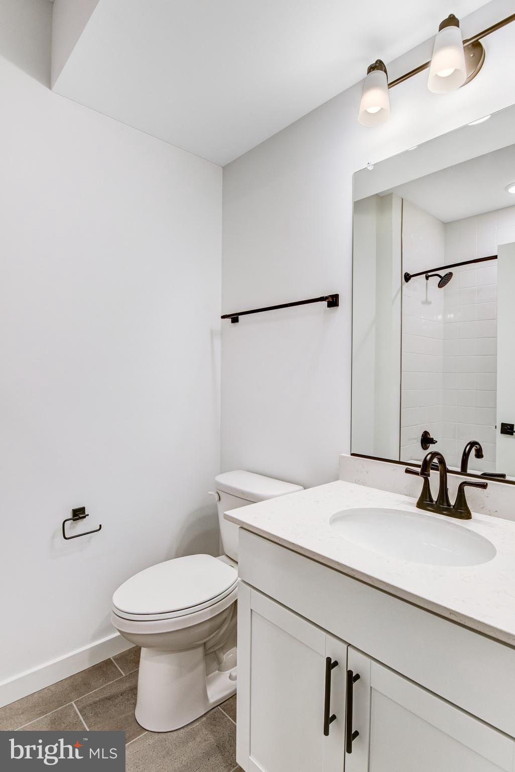 2071 Springvale Drive Bealeton, VA 22712 - Photo 48 of 64 a bathroom with a sink a toilet and mirror