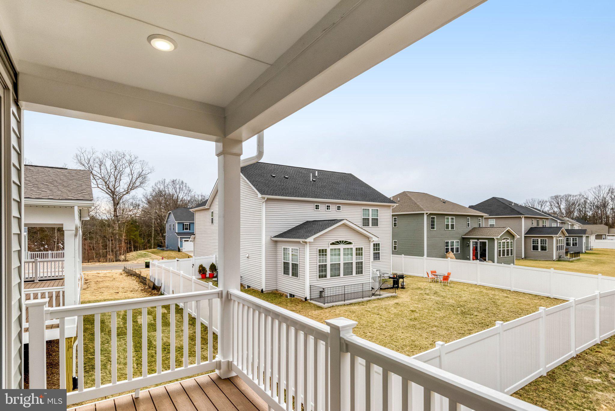 2071 Springvale Drive Bealeton, VA 22712 - Photo 61 of 64 a view of a house with wooden stairs and a floor to ceiling window