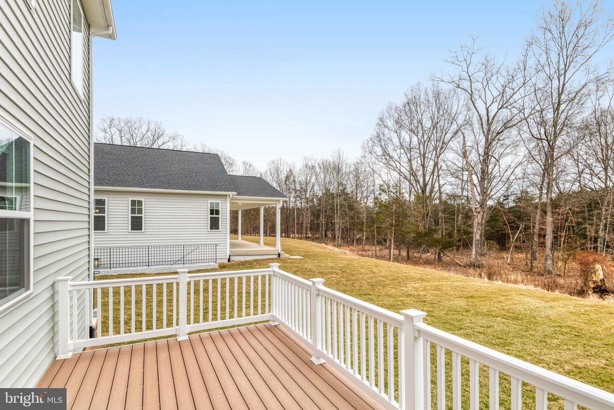 2071 Springvale Drive Bealeton, VA 22712 - Photo 62 of 64 a view of a house with a wooden deck