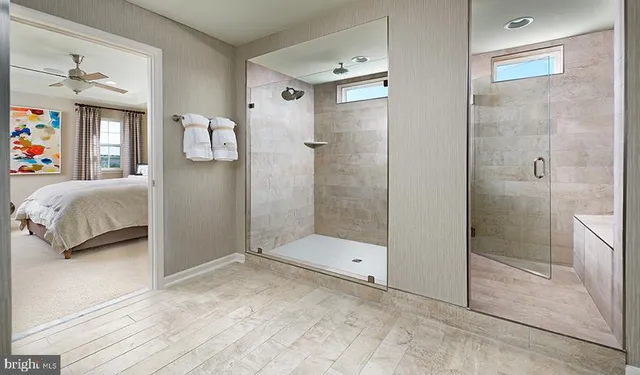 a bathroom with a shower and a sink
