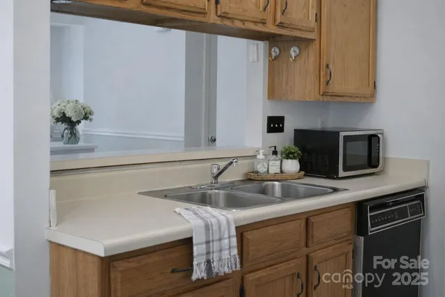 a kitchen with a sink and cabinets