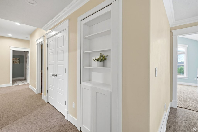 672 Perry Hollow Drive Mapleton, UT 84664 - Photo 68 of 106 upstairs Hallway featuring built-in shelving, carpet flooring, recessed lighting, and white trim molding