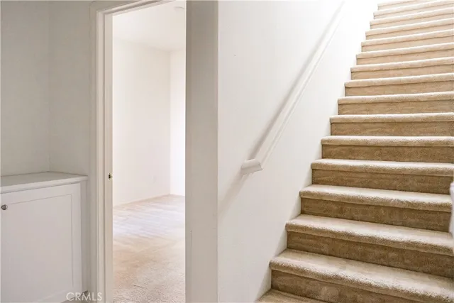 a view of staircase with white walls