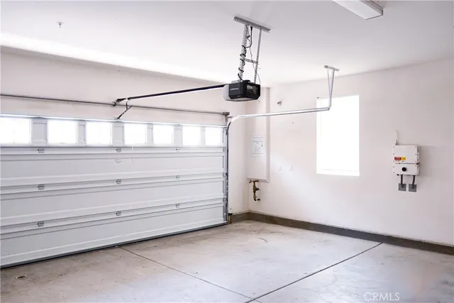 a view of a closet area window and a ceiling fan