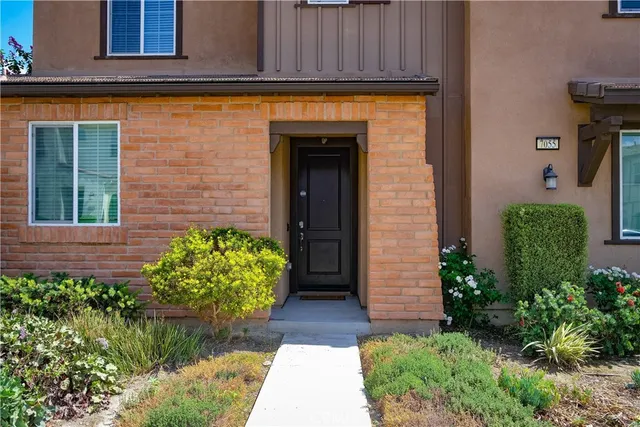 a view of a entryway door front of a house