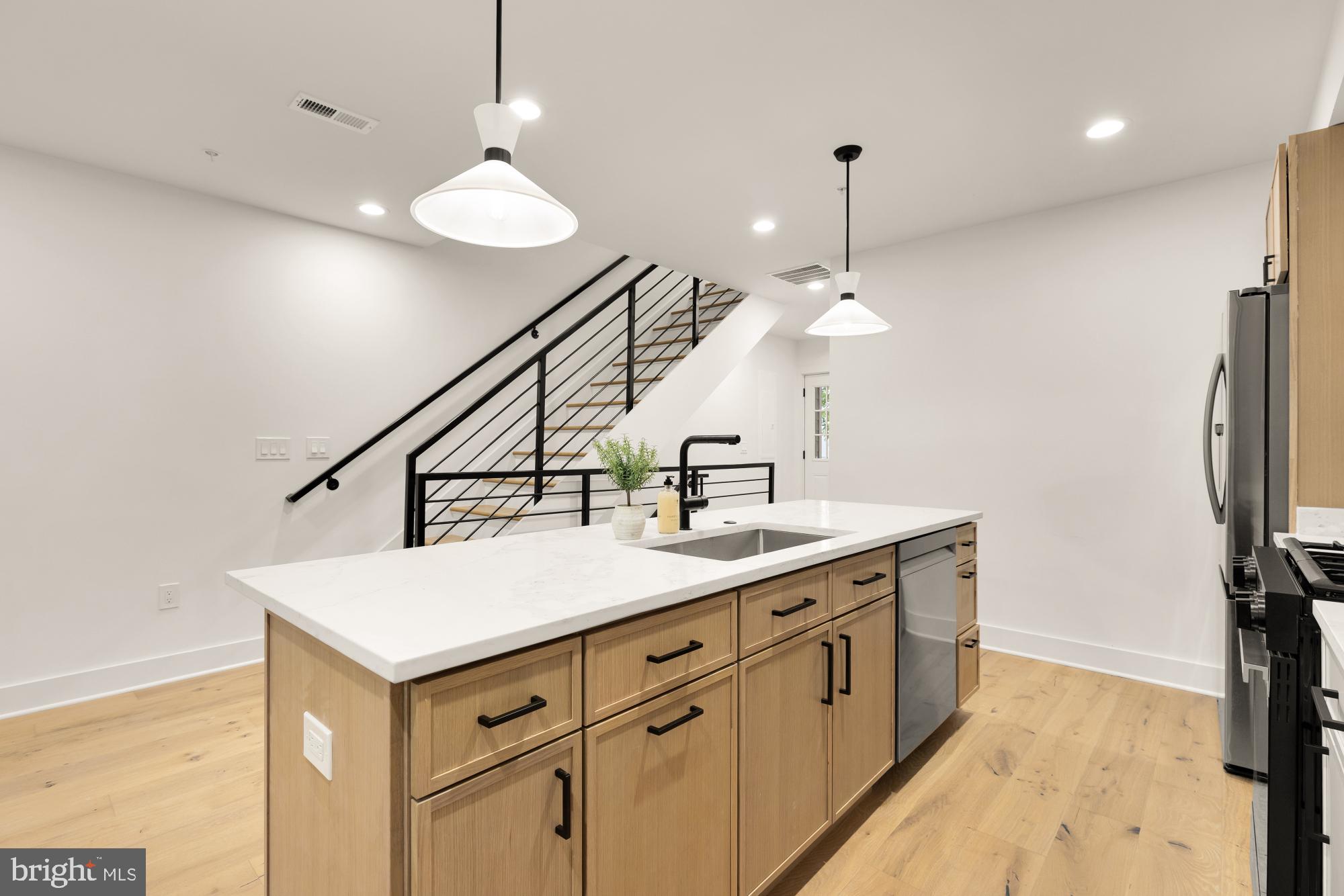 1325 Orren Street Northeast, Unit D Washington, DC 20002 - Photo 12 of 44 a bathroom with a sink a vanity and a mirror
