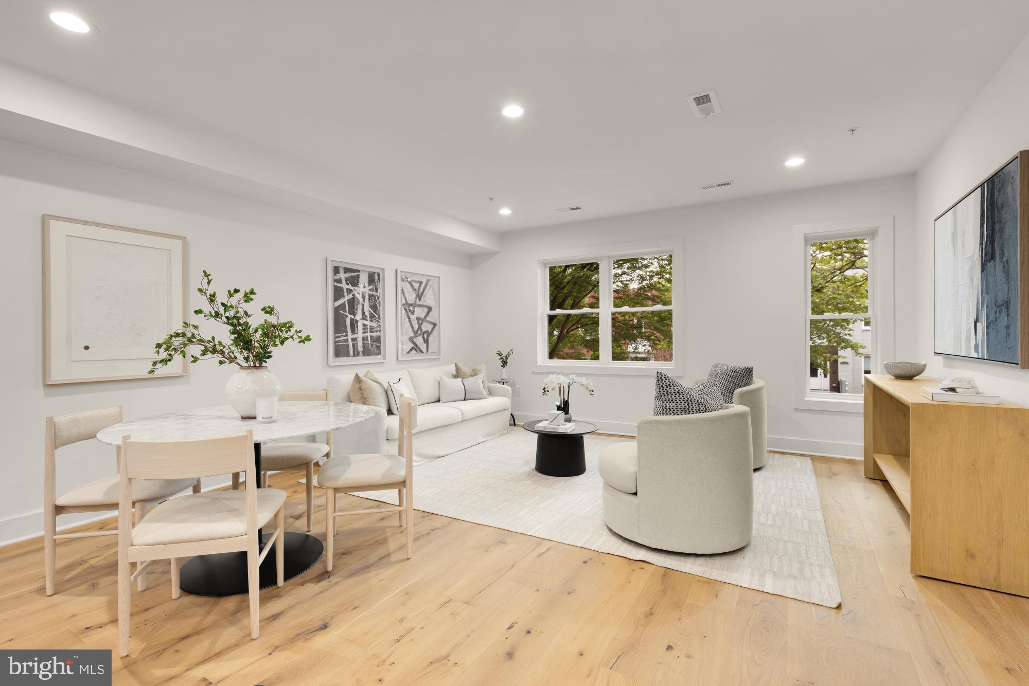 1325 Orren Street Northeast, Unit D Washington, DC 20002 - Photo 2 of 44 a living room with fireplace furniture and a large window