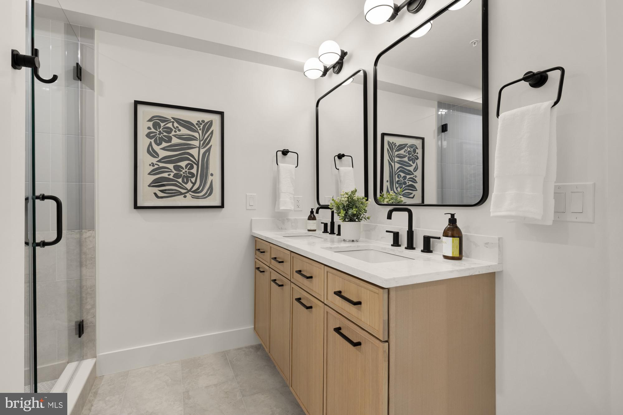 1325 Orren Street Northeast, Unit D Washington, DC 20002 - Photo 23 of 44 a bathroom with a sink vanity and a mirror