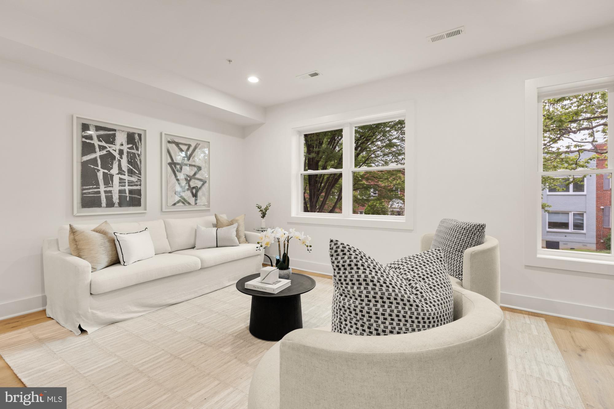 1325 Orren Street Northeast, Unit D Washington, DC 20002 - Photo 3 of 44 a living room with furniture and window