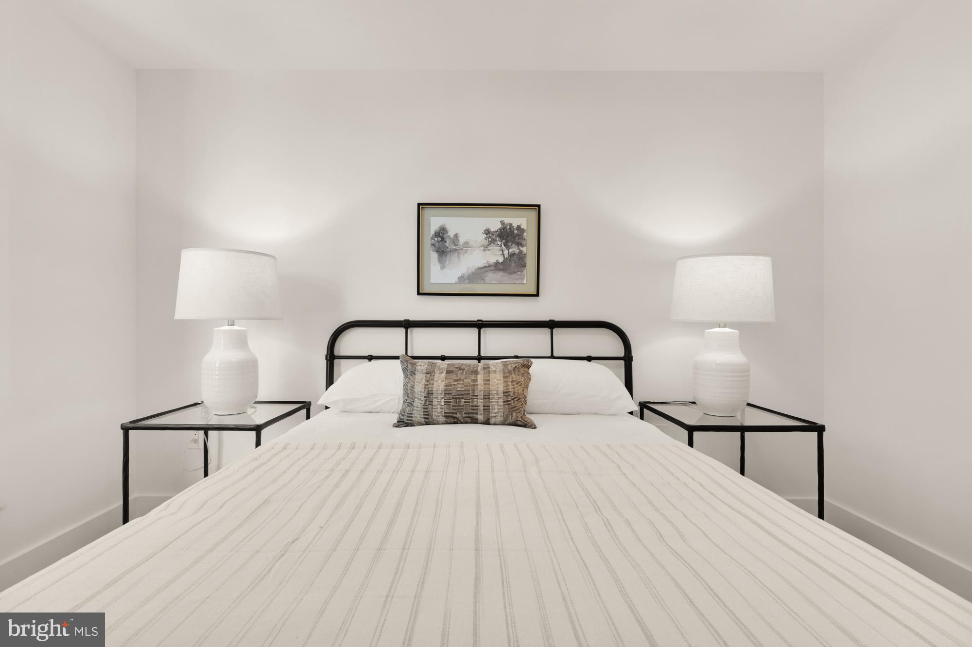 1325 Orren Street Northeast, Unit D Washington, DC 20002 - Photo 31 of 44 a bedroom with a bed and a night lamp