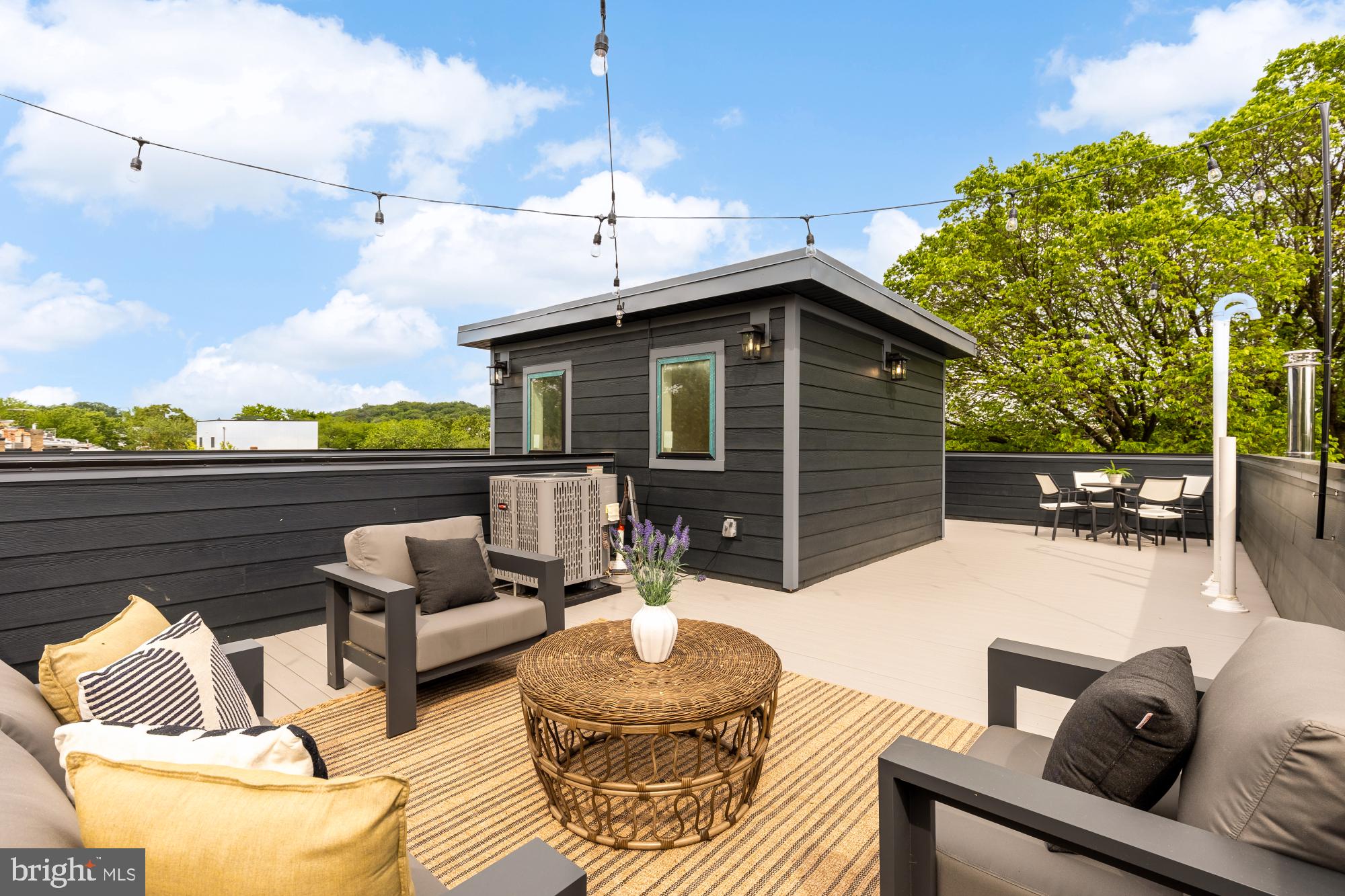 1325 Orren Street Northeast, Unit D Washington, DC 20002 - Photo 35 of 44 a view of a patio with couches chairs and a potted plant